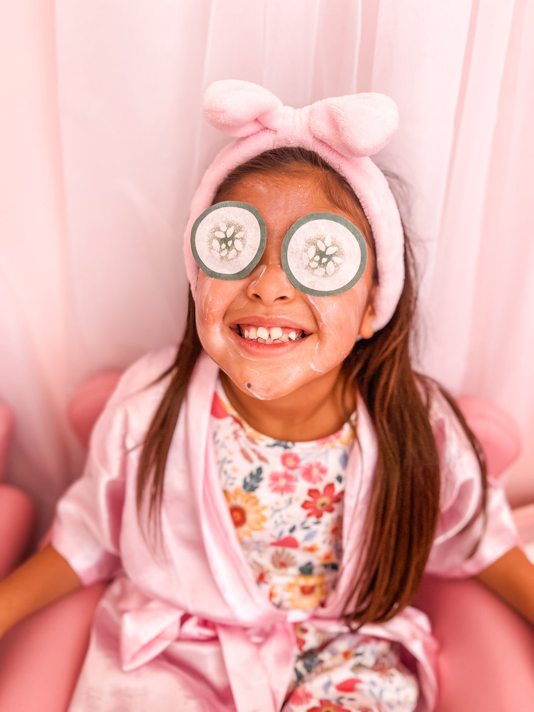 cucumber eyes on little girl getting a facial