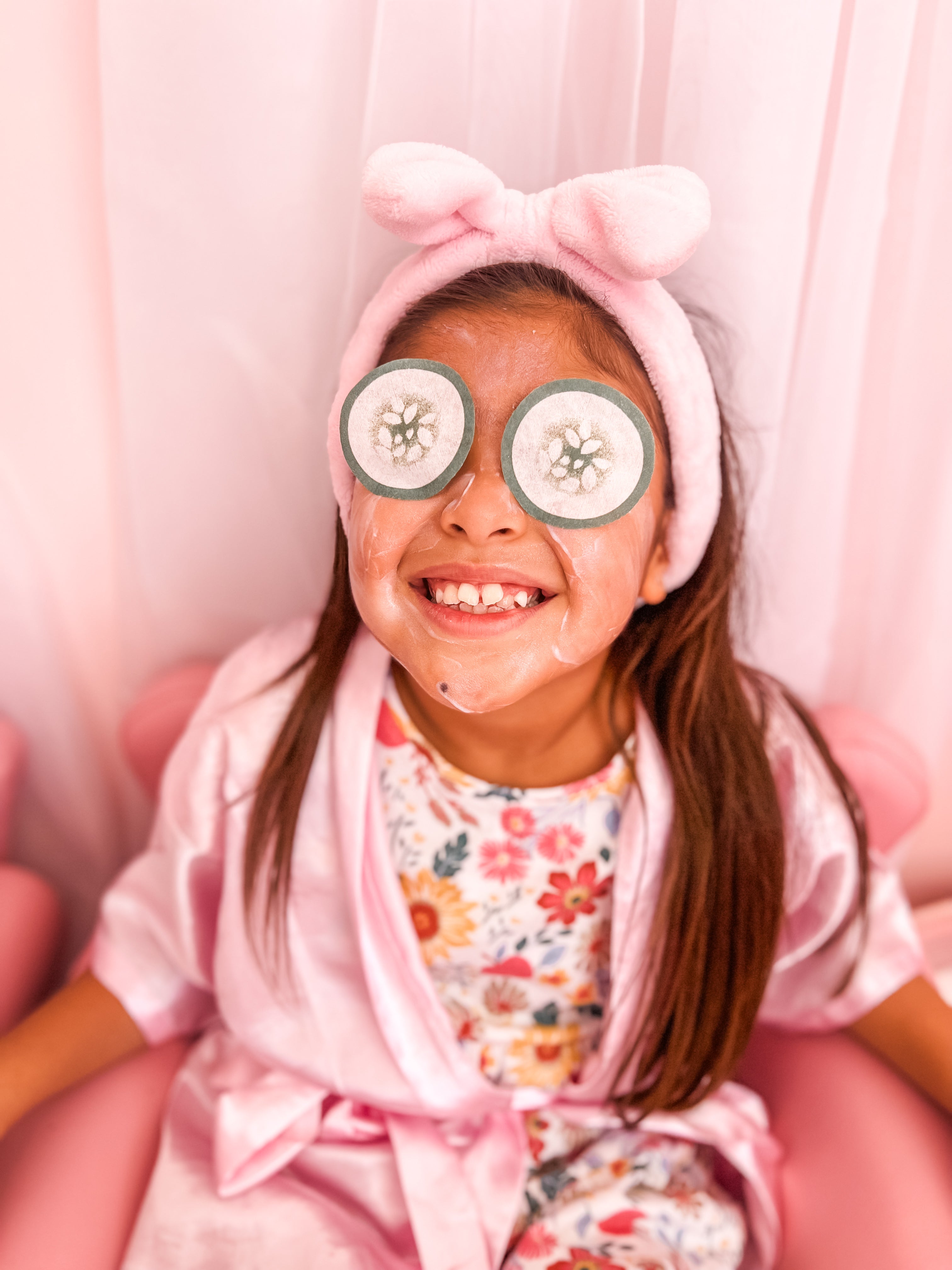 cucumber eyes on little girl getting a facial