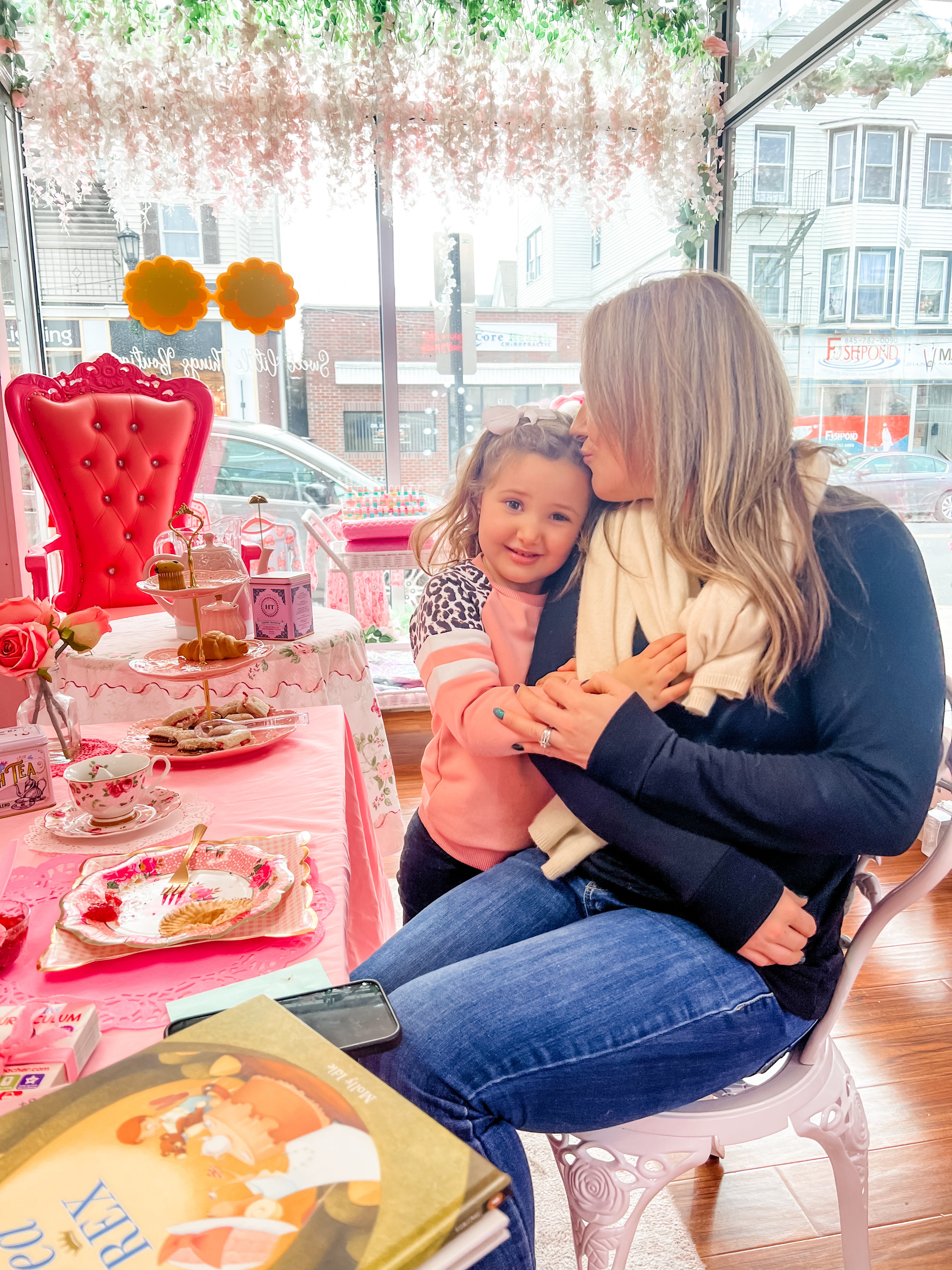 Mother and daughter having a tea party