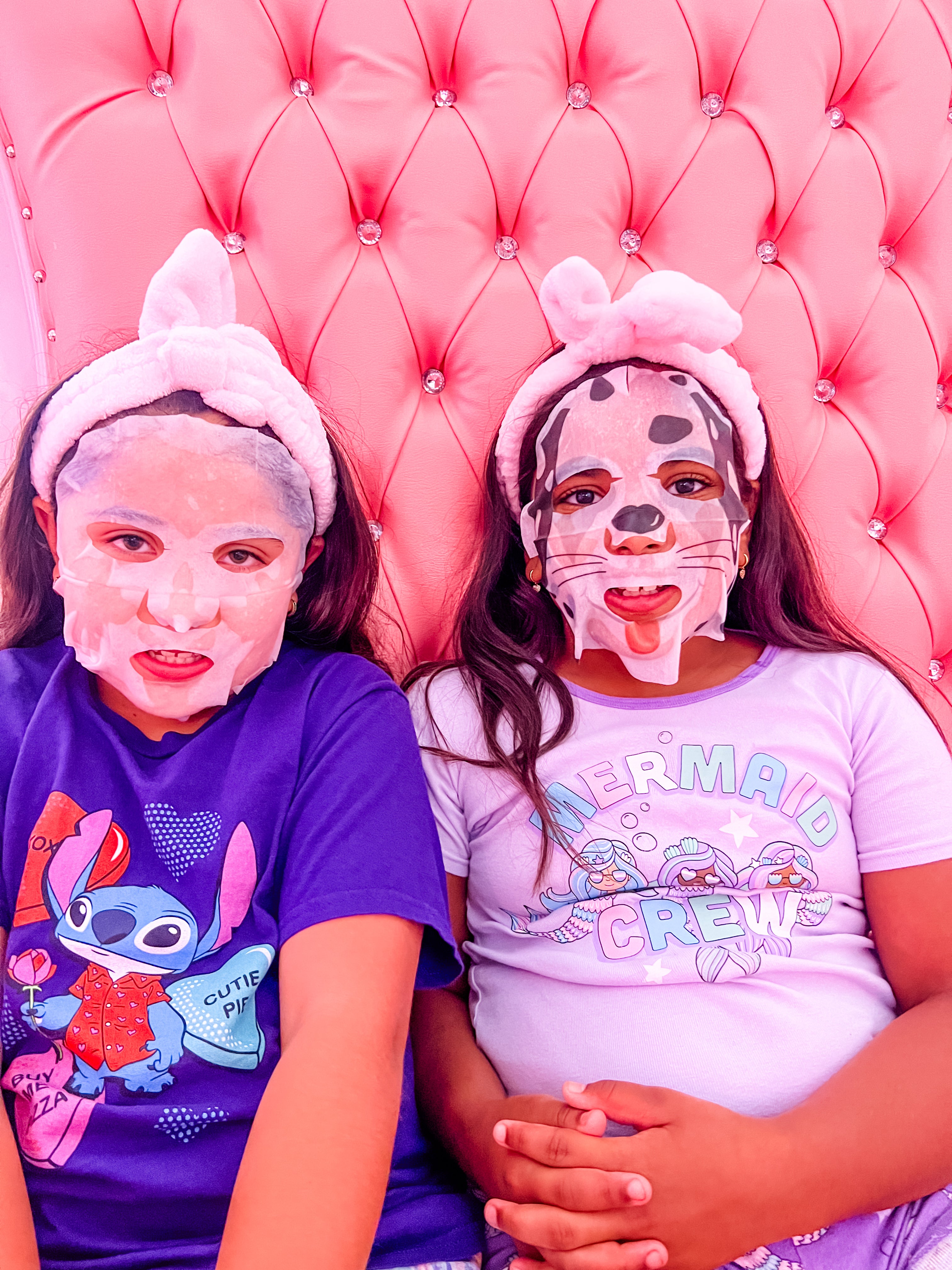 Excited girls receiving a facial on throne chairs
